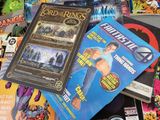 a lot of comic books on the table together