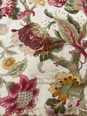 a close up of a floral print on a table cloth