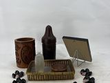 an assortment of items including a bottle, a tray, and a mirror