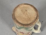 a close up of a coffee cup with a lid