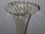 a glass vase that is sitting on a table