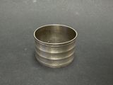 a silver cup that is sitting on a table