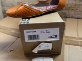 a box with a pair of shoes on top of it