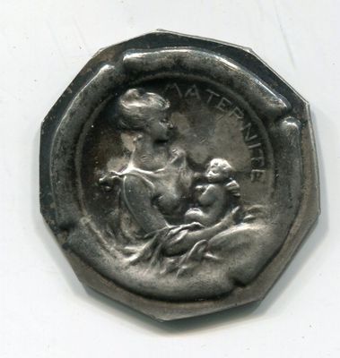a silver coin with a picture of a woman on it