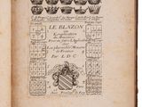 an old book with a drawing of a crown on it