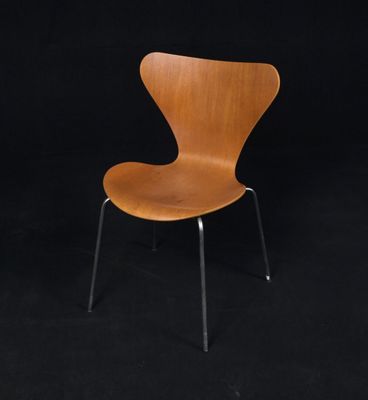 an image of a wooden chair against a black background