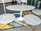 a table with four tables on it in a room