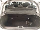 the back of a car with the trunk open and the seat folded down