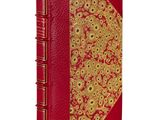 une image représentant un livre rouge aux bords dorés et à la couverture rouge
