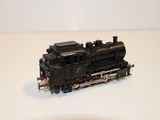 a toy train on a white surface with a white background