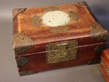 a small wooden box sitting next to a smaller wooden box