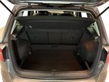 the back of a car with the trunk open and luggage in the trunk