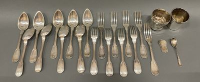 many spoons and forks laid out on the table