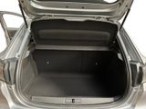 a trunk of a silver car with its doors open