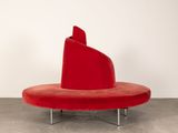an image of a red chair in a white room