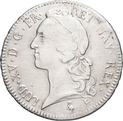 a close up of a coin with a woman ' s face on it