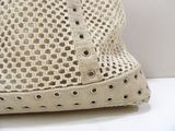 a white bag with holes on it sitting on a table