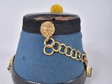 a blue hat with a gold chain around it