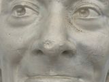 a close up of a sculpture of a man ' s face