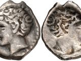 a silver coin with an image of a woman on it