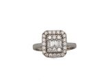 a close up of a diamond ring on a white background