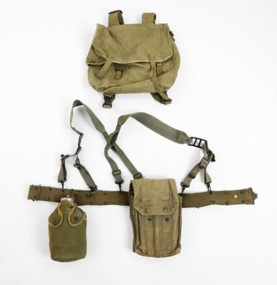 an assortment of military items including a backpack, belt and pouch