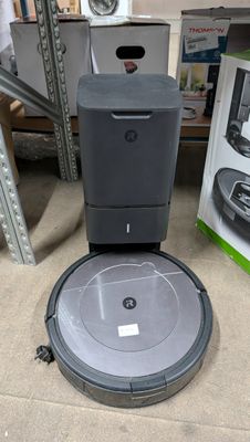 an image of a robotic vacuum cleaner sitting on the floor