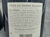 a bottle of wine that is sitting on a table