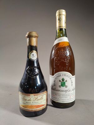 two bottles of wine sitting next to each other on a table