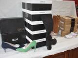 a table with a lot of shoes and boxes on it