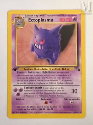 a close up of a pokemon card on a white surface