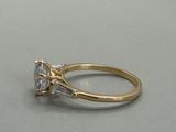 a close up of a diamond ring on a table