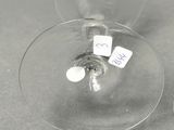 two empty wine glasses sitting on a table