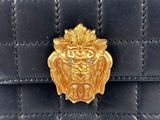 chanel black quilted lambskin with gold lion head clasp