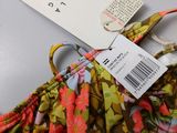 brand new women ' s floral print bralette with tags on it
