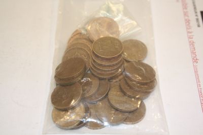 a bag full of coins sitting on a table
