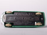 a close up of a small electronic device on a white surface