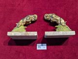 pair of antique brass fish bookends on marble bases
