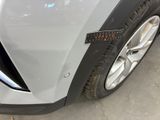 a close up of a car ' s front bumper with a sticker on it