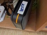 an image of a computer mouse and a printer on a desk