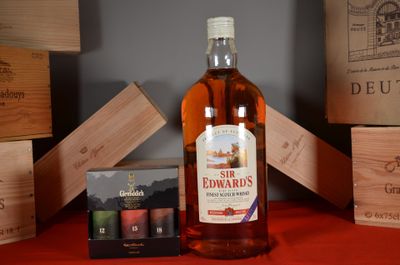 une bouteille de vin et une boîte de bougies posées sur une table