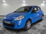 the small blue car is parked in a large room