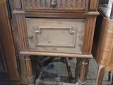 a small wooden table with a drawer on top of it