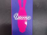 a pink box with a pink bunny on it sitting on a black surface