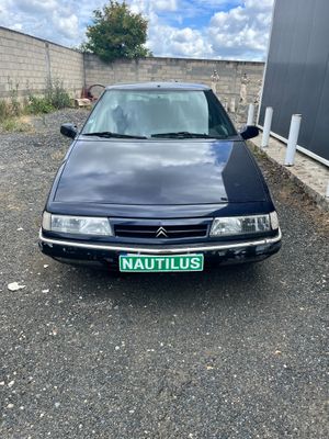 a picture of a black car parked in a parking lot
