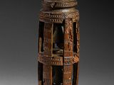 an image of a wooden vase with carvings on it