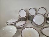 a lot of plates that are sitting on a table