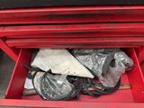 a red tool box filled with assorted items