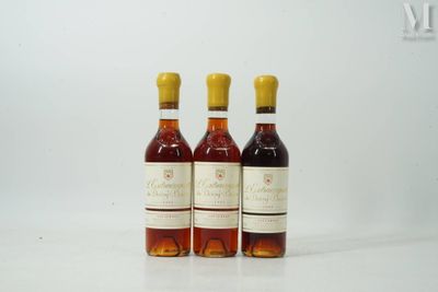 three bottles of wine sitting next to each other on a table