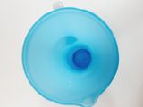 a blue plastic cup sitting on top of a white table